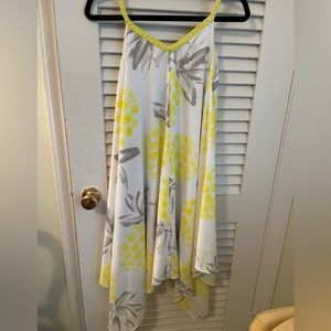 Swirly dress with braided straps and uneven hem.  Yellow and grey on white.